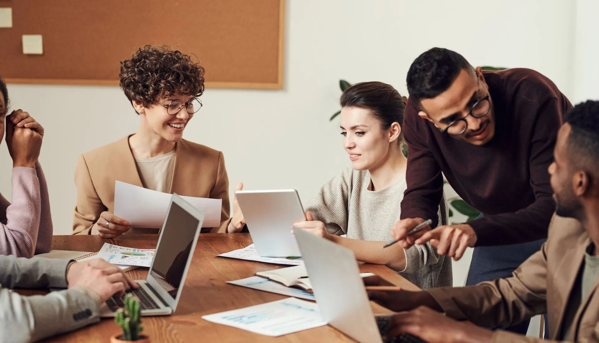 The AI Ads HQ team collaborating in a modern workspace